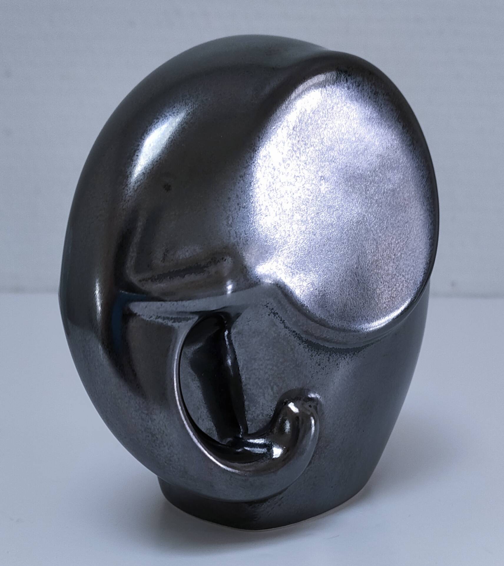 Two iridescent black and white ceramic elephants design