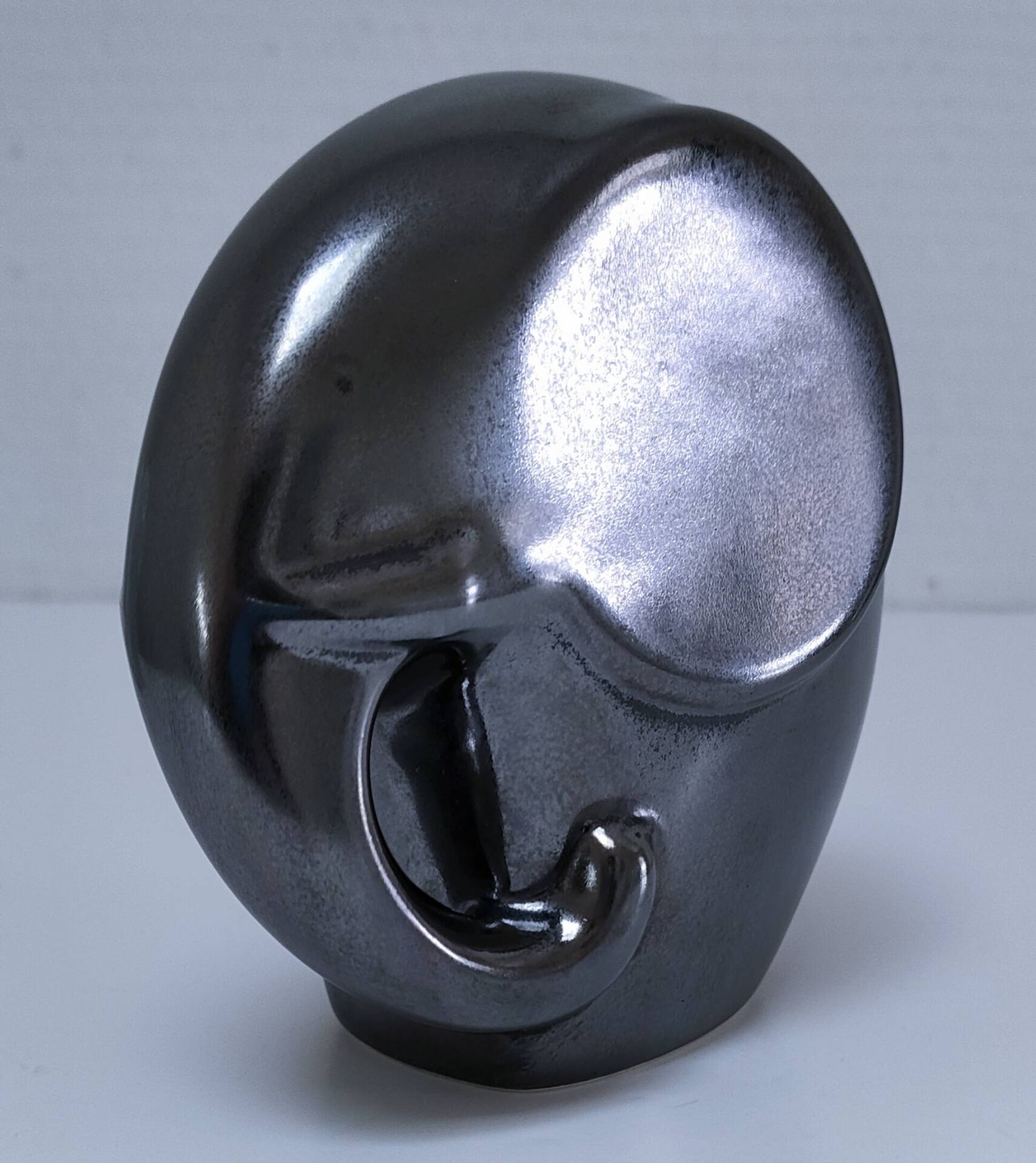 Two iridescent black and white ceramic elephants design