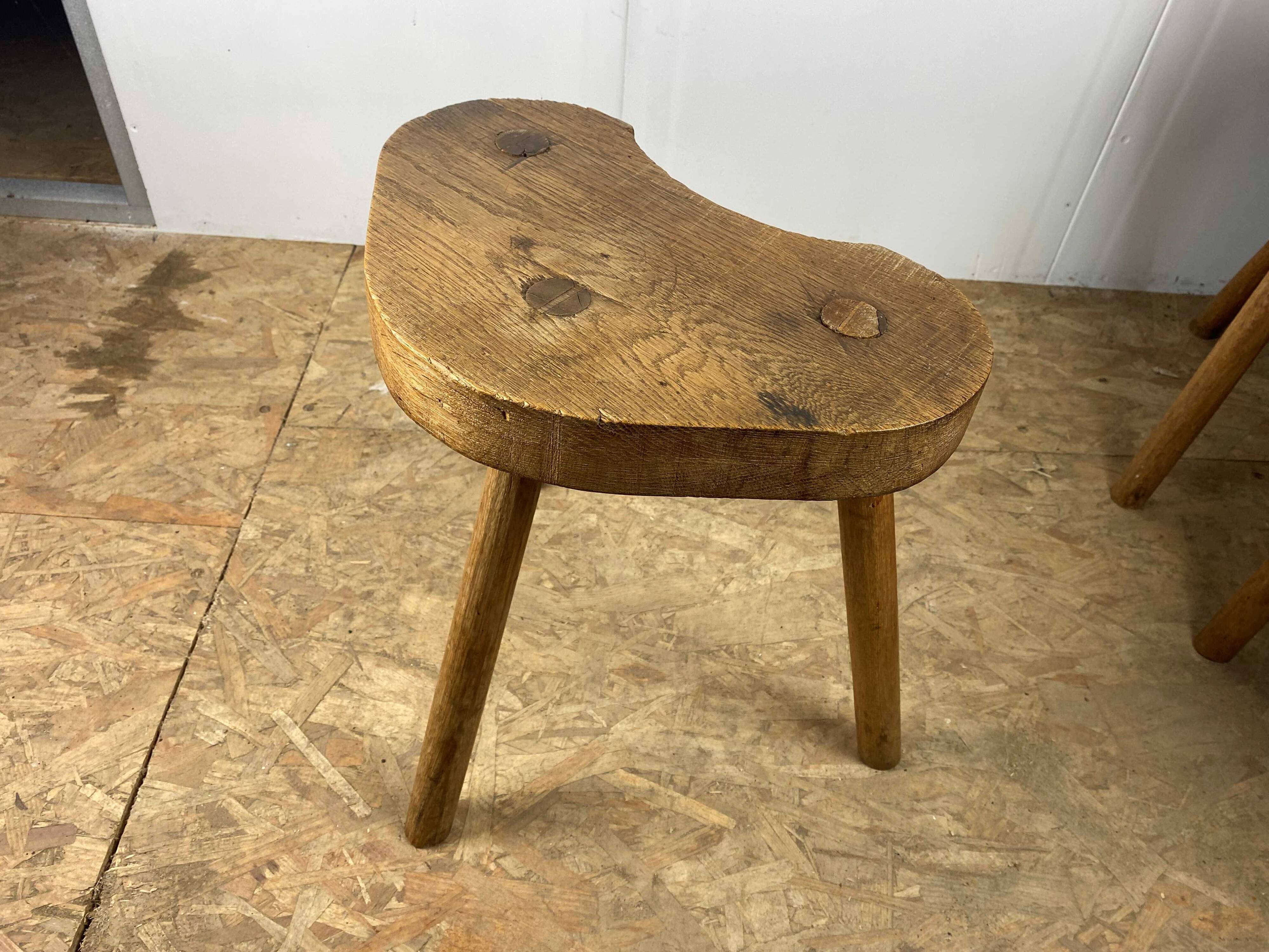 Set of 6 brutalist solid oak tripod farm stools from the 1950s
