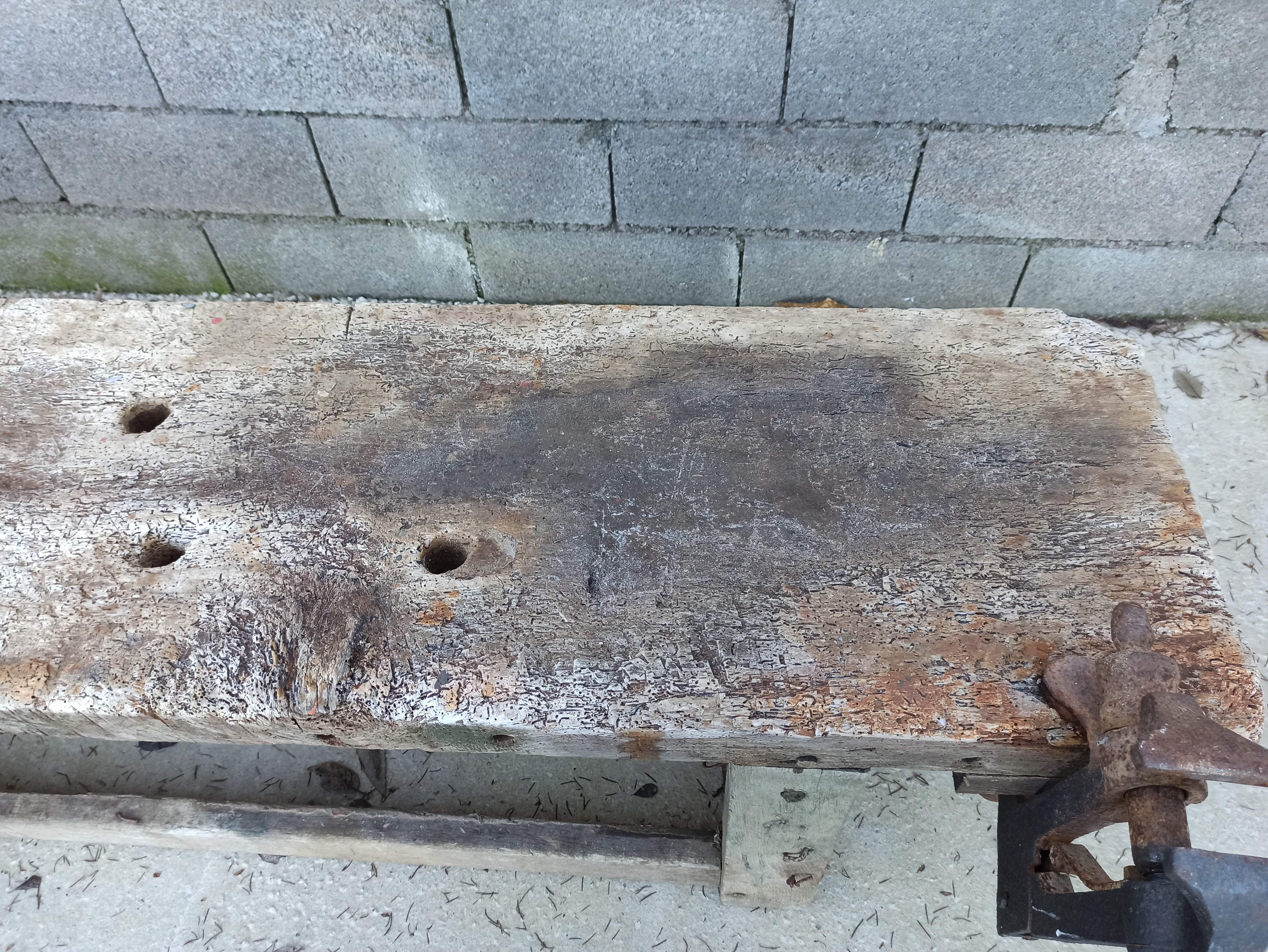 Wooden carpenter's workbench with iron and wooden vice
