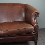 2-seater sofa in sheepskin decorative nails