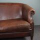 2-seater sofa in sheepskin decorative nails