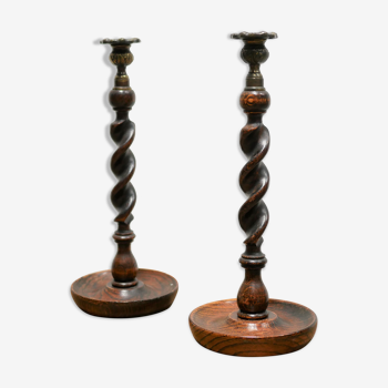 Pair of antique candle holders in wood and bronze