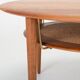 Table basse ronde en teck et en rotin par Peter Hvidt et Orla Mølgaard Nielsen pour France & Søn, années 1960.