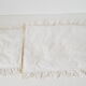 Old rattan bassinet and bedding