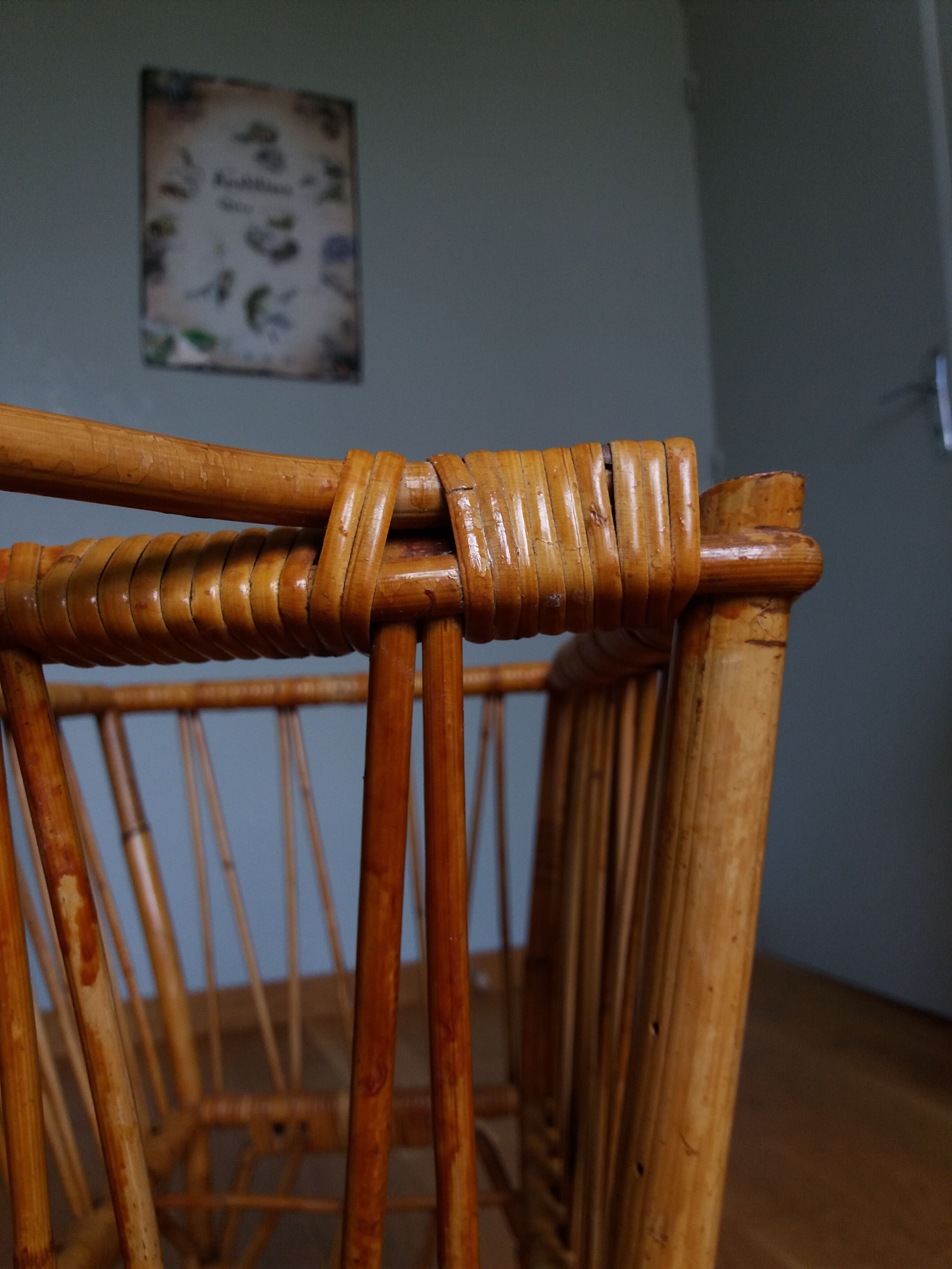 Rattan wicker cradle on wooden wheels