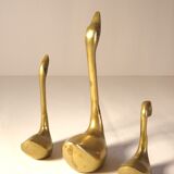 Trio of brass swans