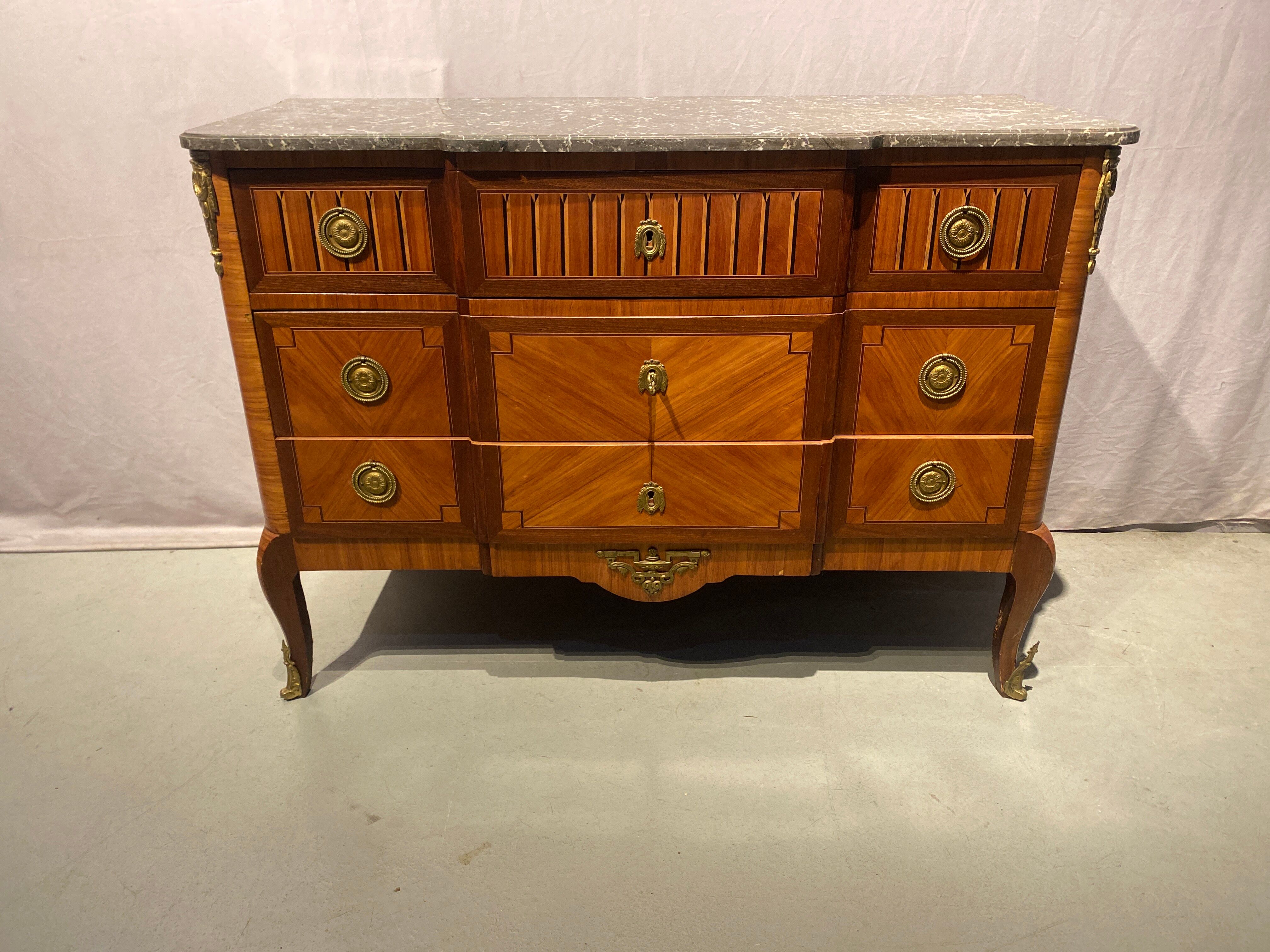 Inlaid chest of drawers with marble top