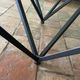 Design coffee table in glass and black metal – Geometric base
