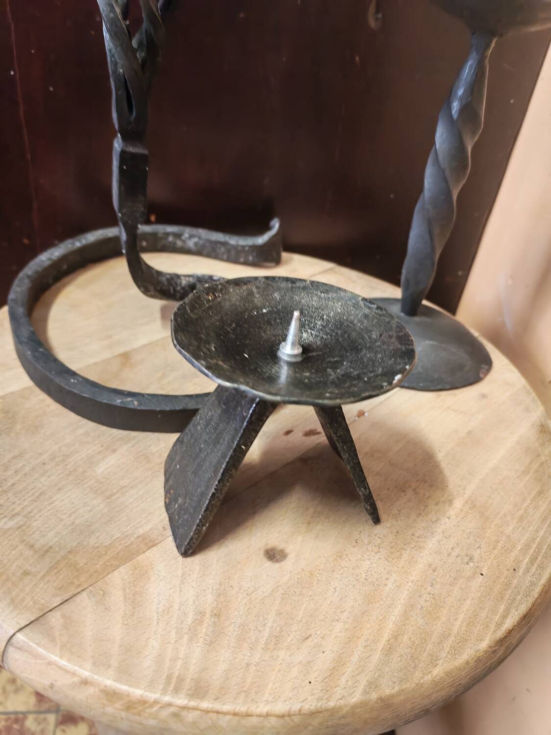 Set of 3 candlesticks and a candle holder in wrought iron.