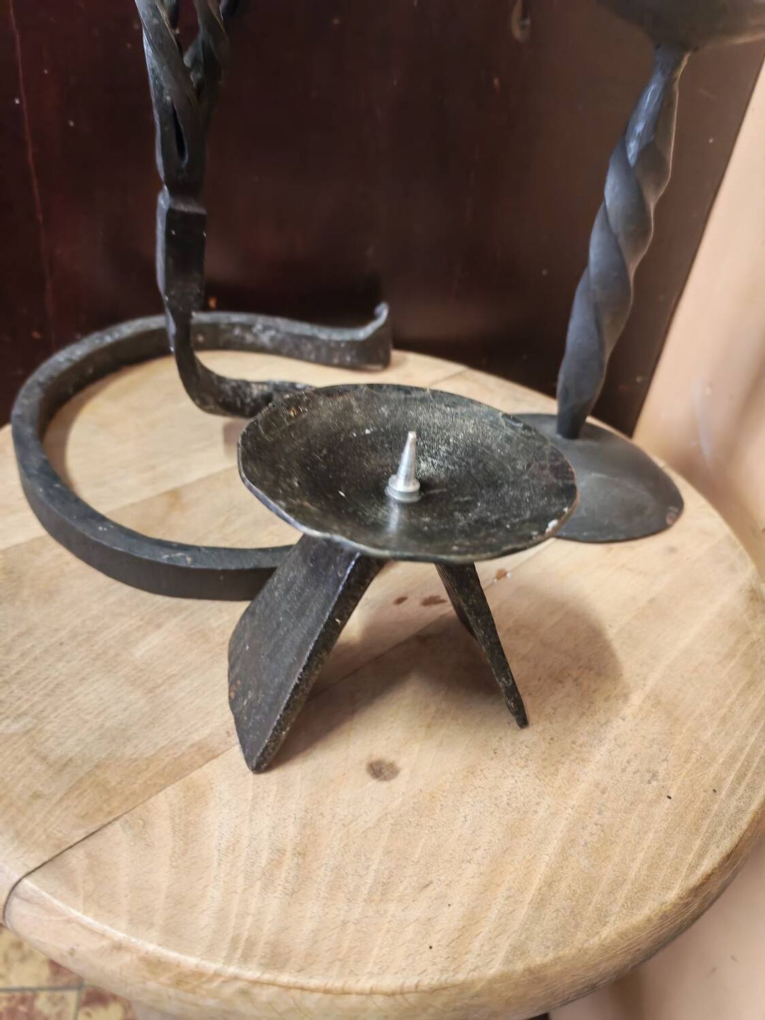 Set of 3 candlesticks and a candle holder in wrought iron.