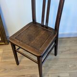 Pair of 1930s bistro chairs with patinated wood.