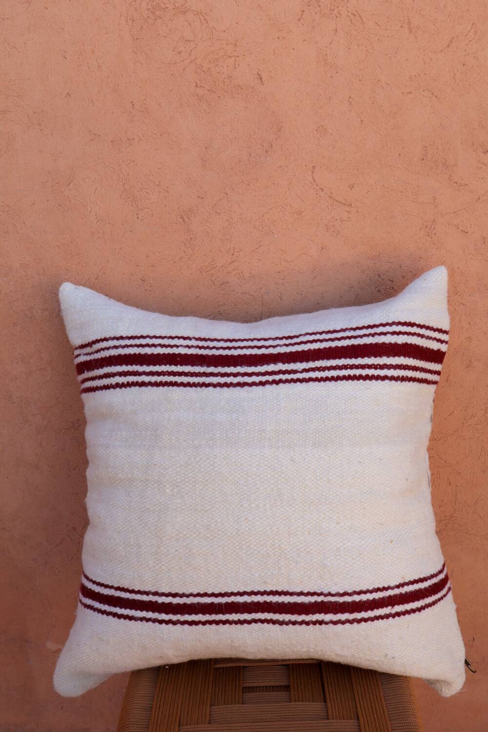burgundy and white striped cushion in handmade wool