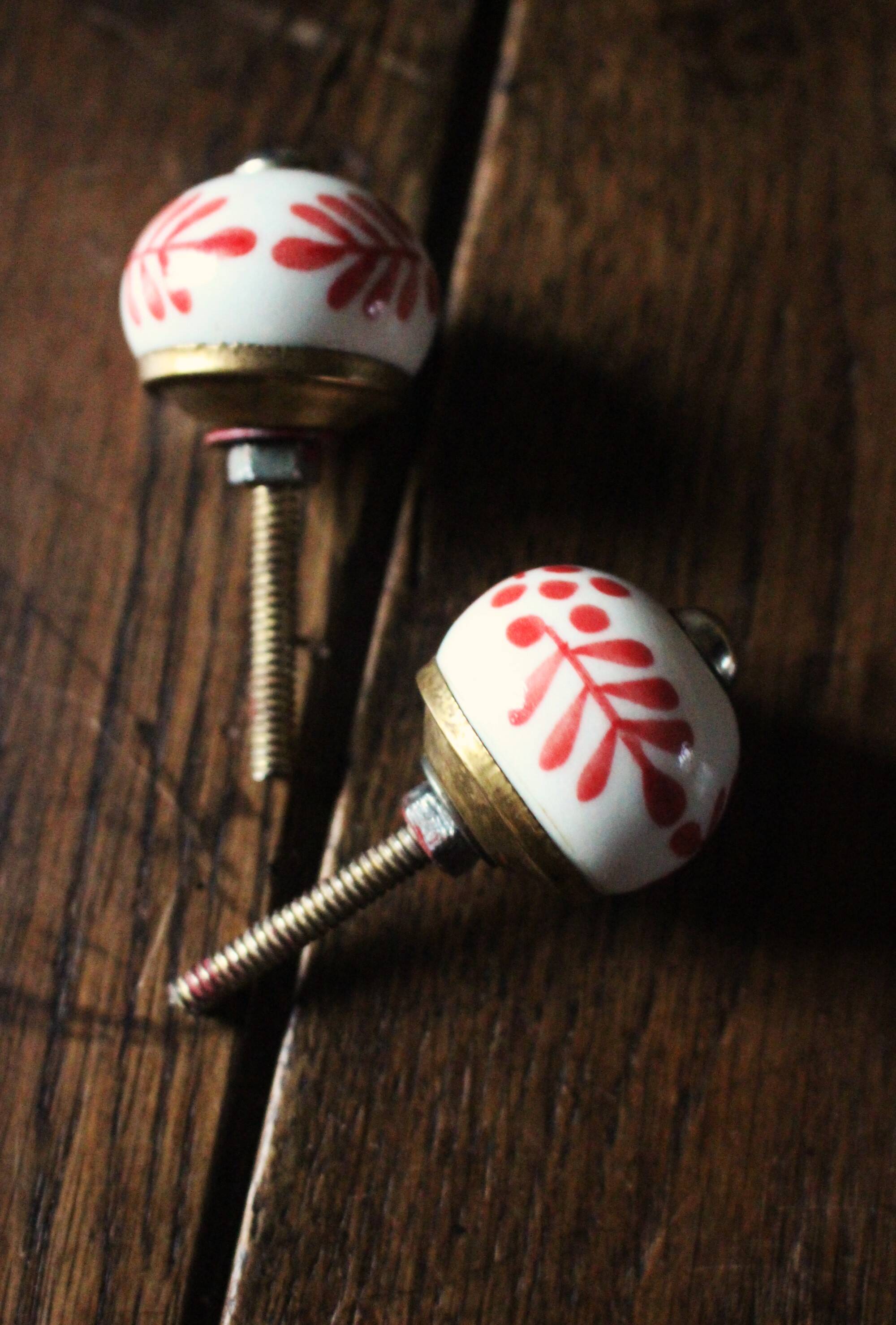 Pair of white and red porcelain drawer cupboard door knobs