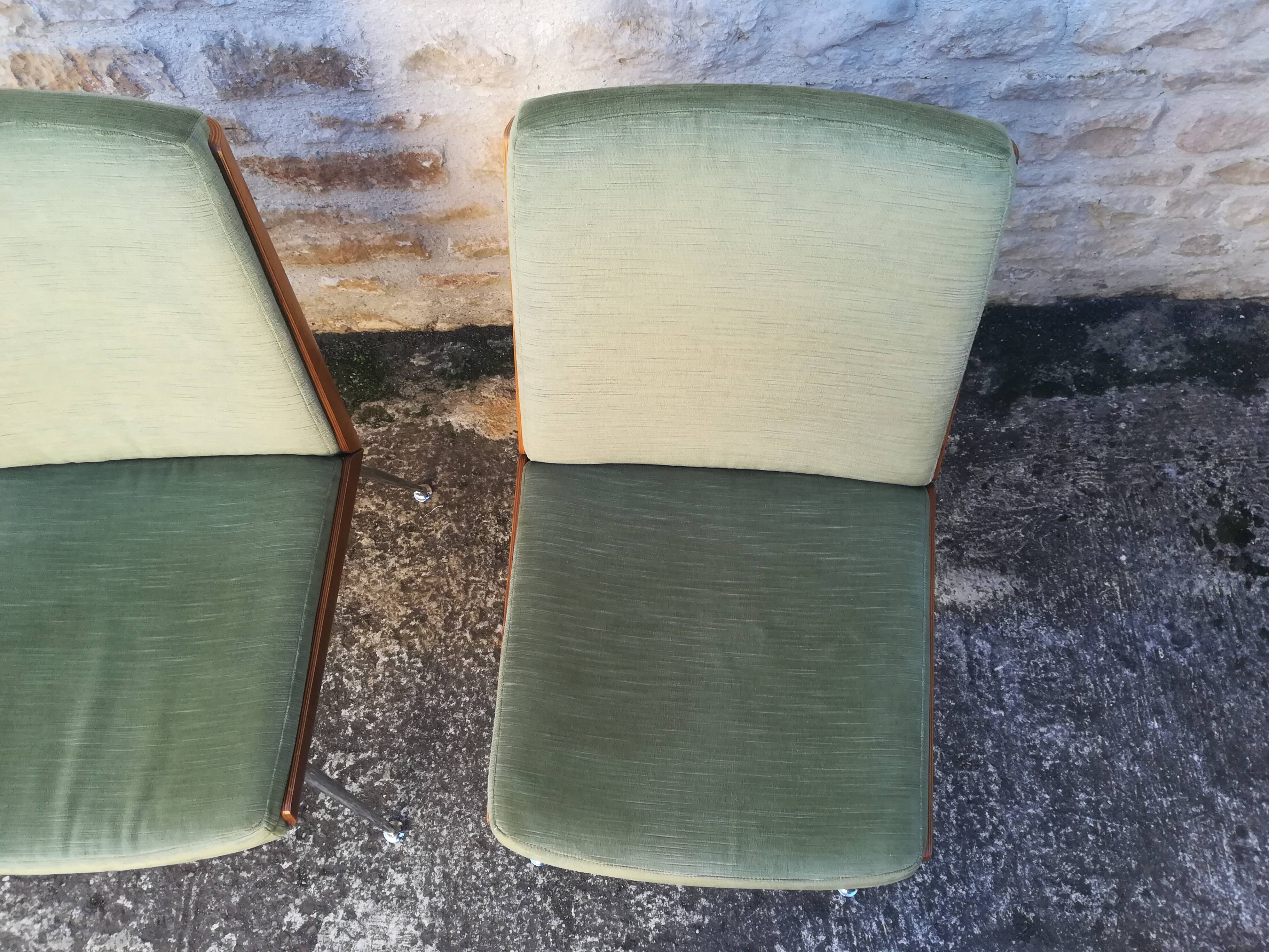 Shell chairs and green fabric