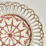 Pair of openwork porcelain plates decorated with roses