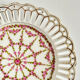 Pair of openwork porcelain plates decorated with roses