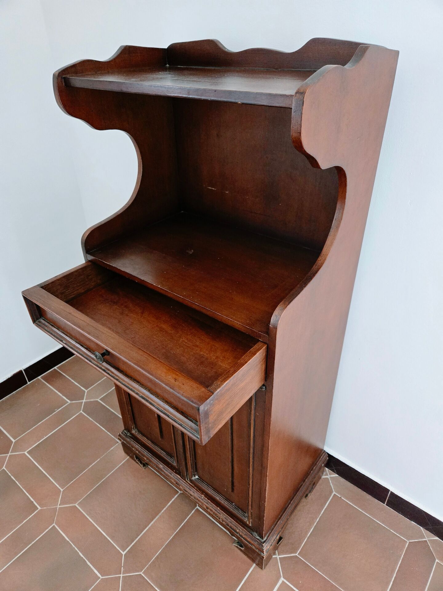 Small antique accent table made of solid wood.