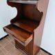 Small antique accent table made of solid wood.