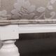 Two-seater canapé painted white with reupholstered beige fabric, wooden frame painted in 1890 style.