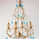 Italian chandelier in gold metal and blue crystal drops