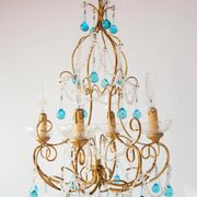 Italian chandelier in gold metal and blue crystal drops