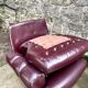 Pair of upholstered armchairs in aubergine imitation leather