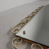 Vintage faceted mirror in an aluminium frame from the 1950s.