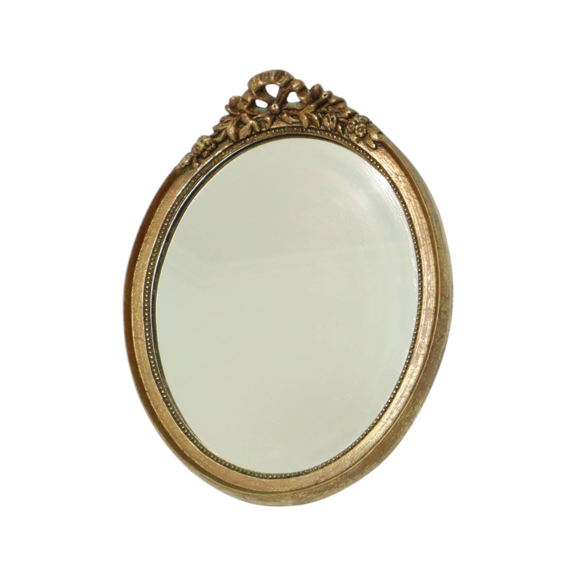 Miroir ovale vintage en résine dorée à la feuille d'or, style années 60. Classique.