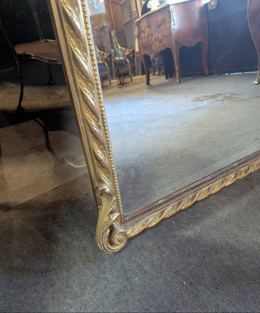 Very large Louis XVI style mirror in wood and gilded stucco with gold leaf