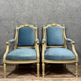 Pair of Louis XVI style armchairs in molded, carved wood