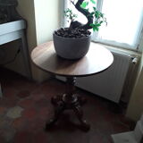 Old round table on centre foot