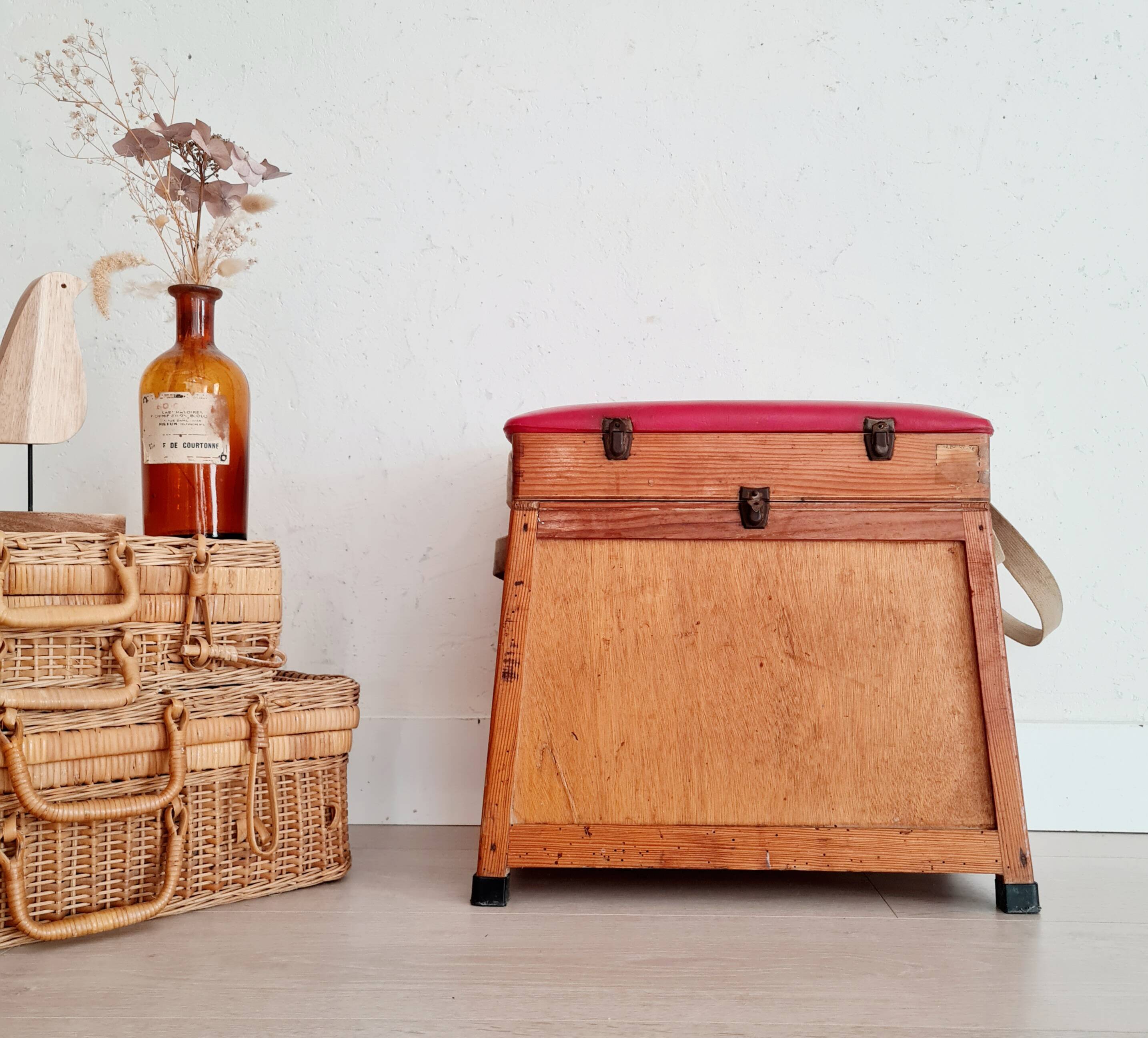 Old fisherman's stool with red seat