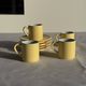 Set of 4 vintage yellow Italian espresso cups and saucers.