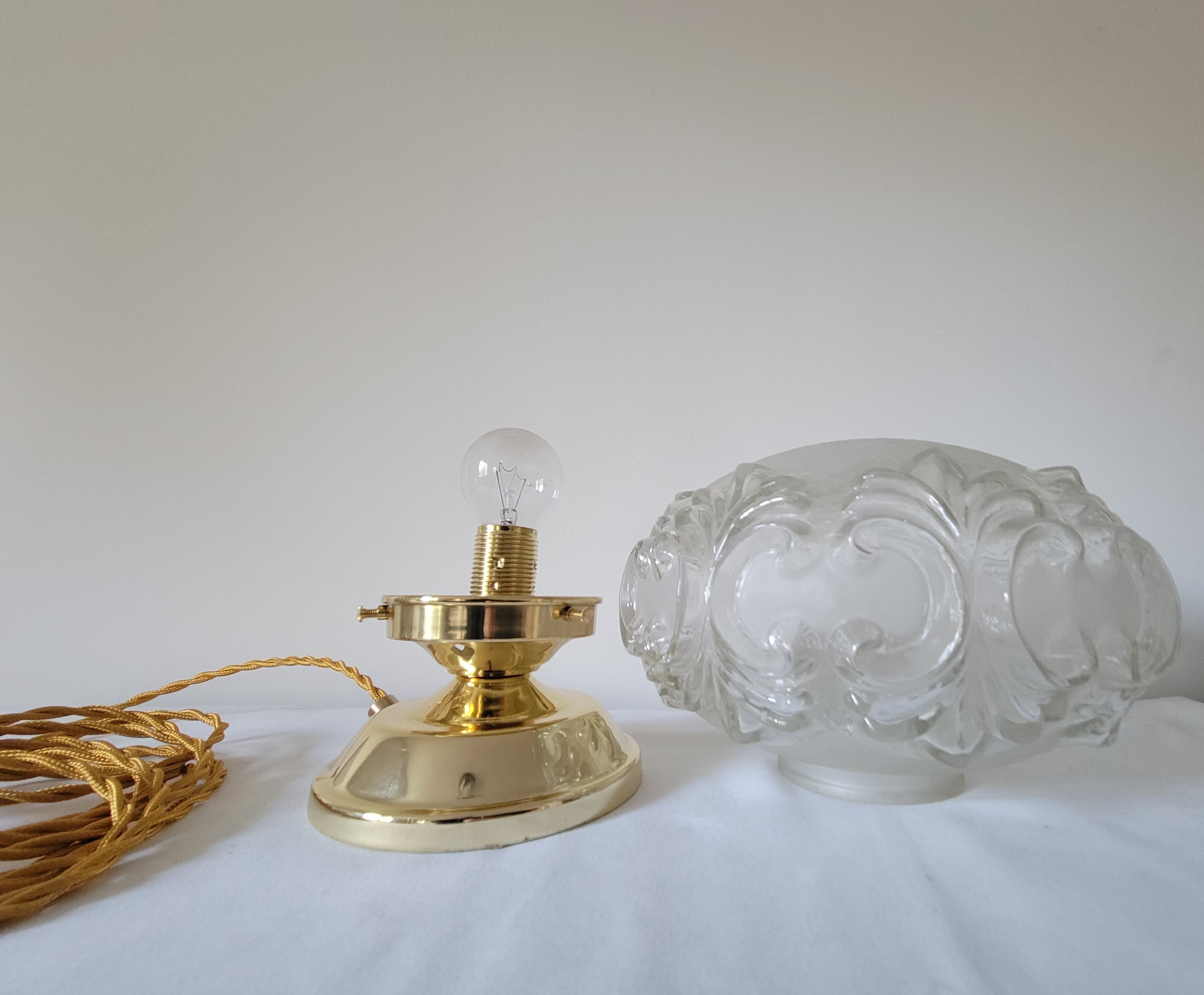 Brass lamp with molded glass globe