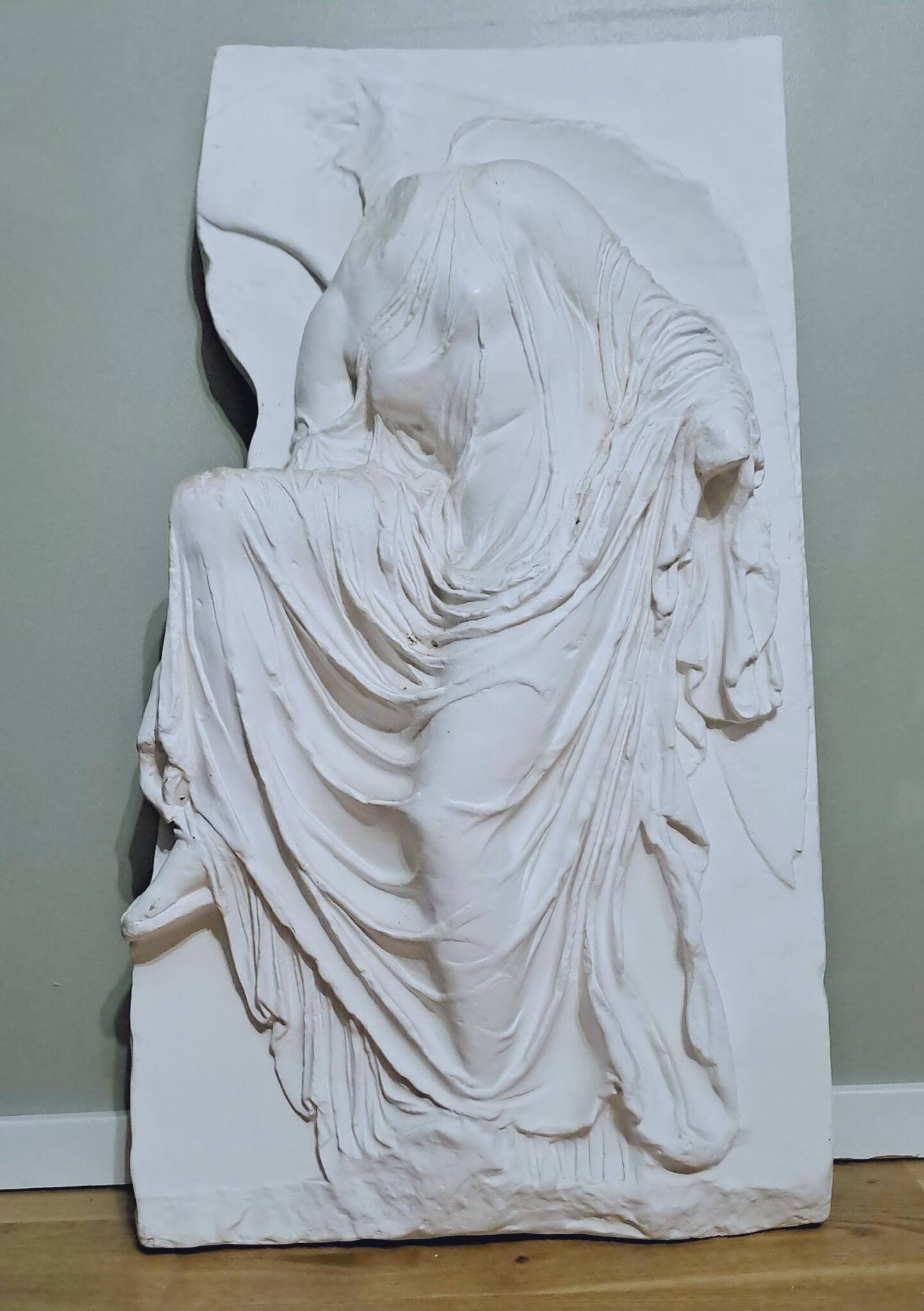Plaster bas relief "Athena adjusting her sandal"