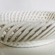 Covered basket in white woven ceramic and fruit slip.
