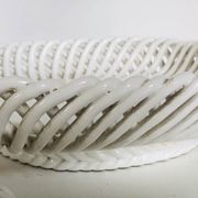 Covered basket in white woven ceramic and fruit slip.