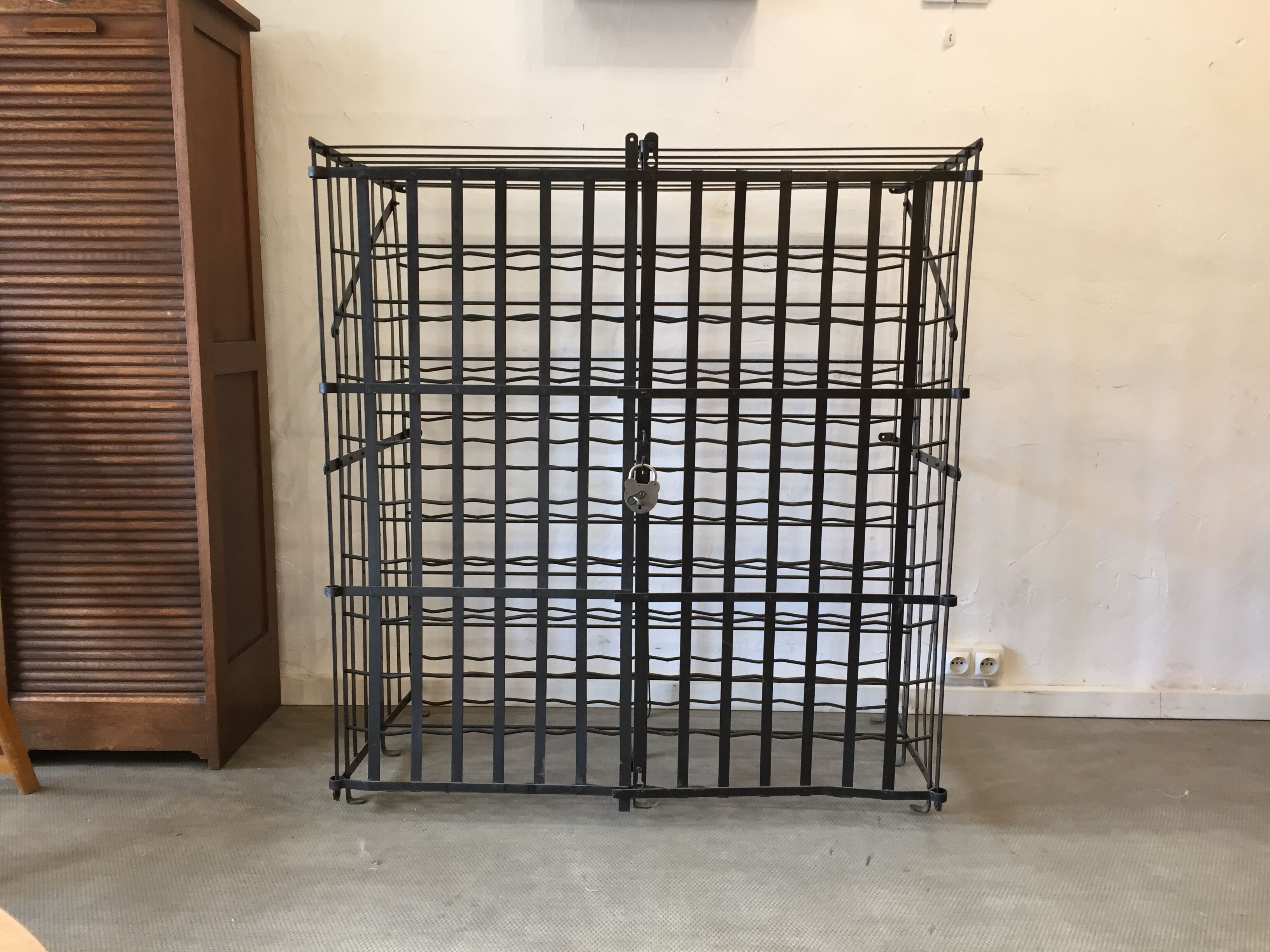 wine in metal cage wine cellar