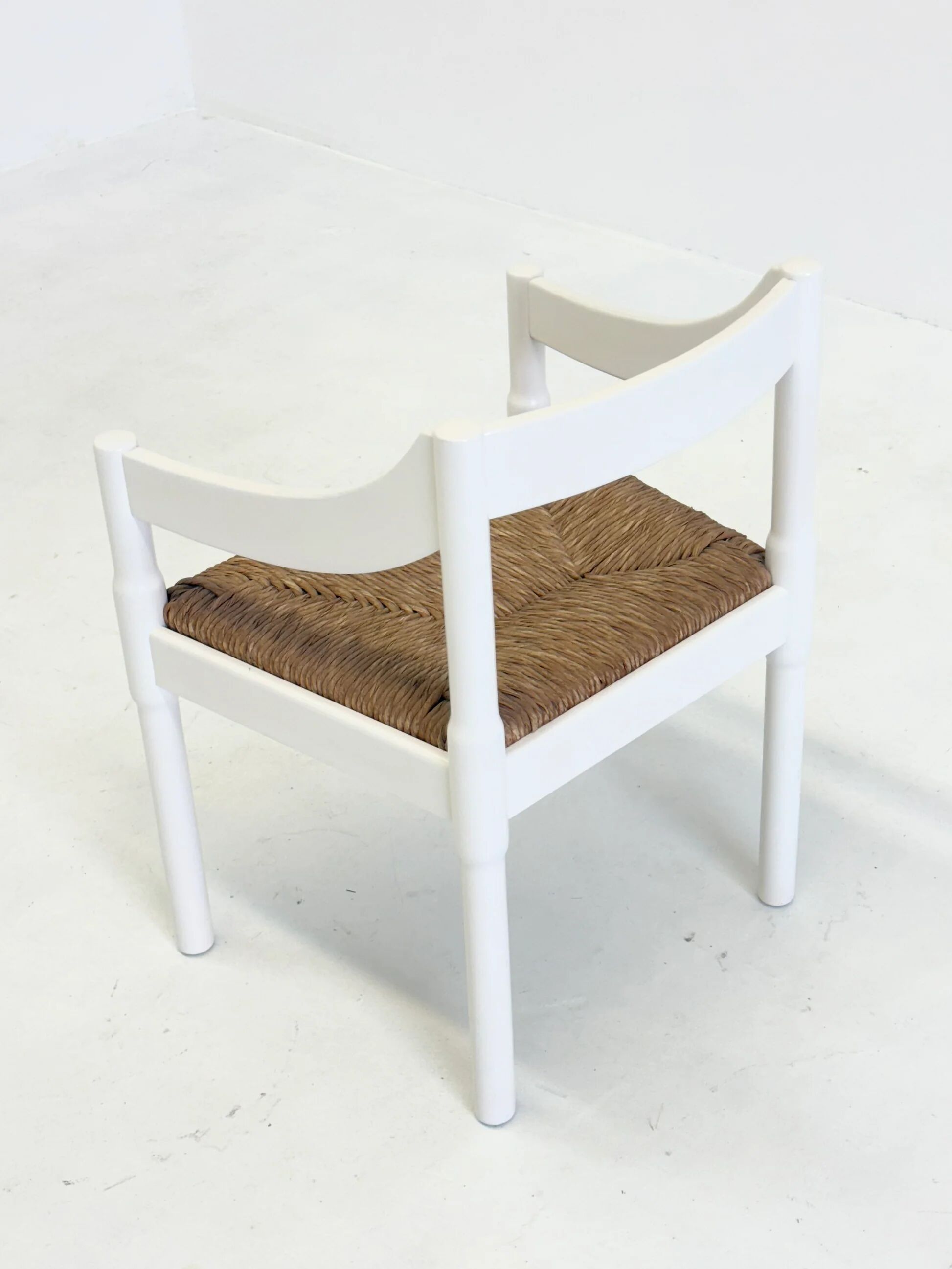 Set of two Carimate chairs by Vico Magistretti in white
