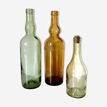 Set of three old glass bottles