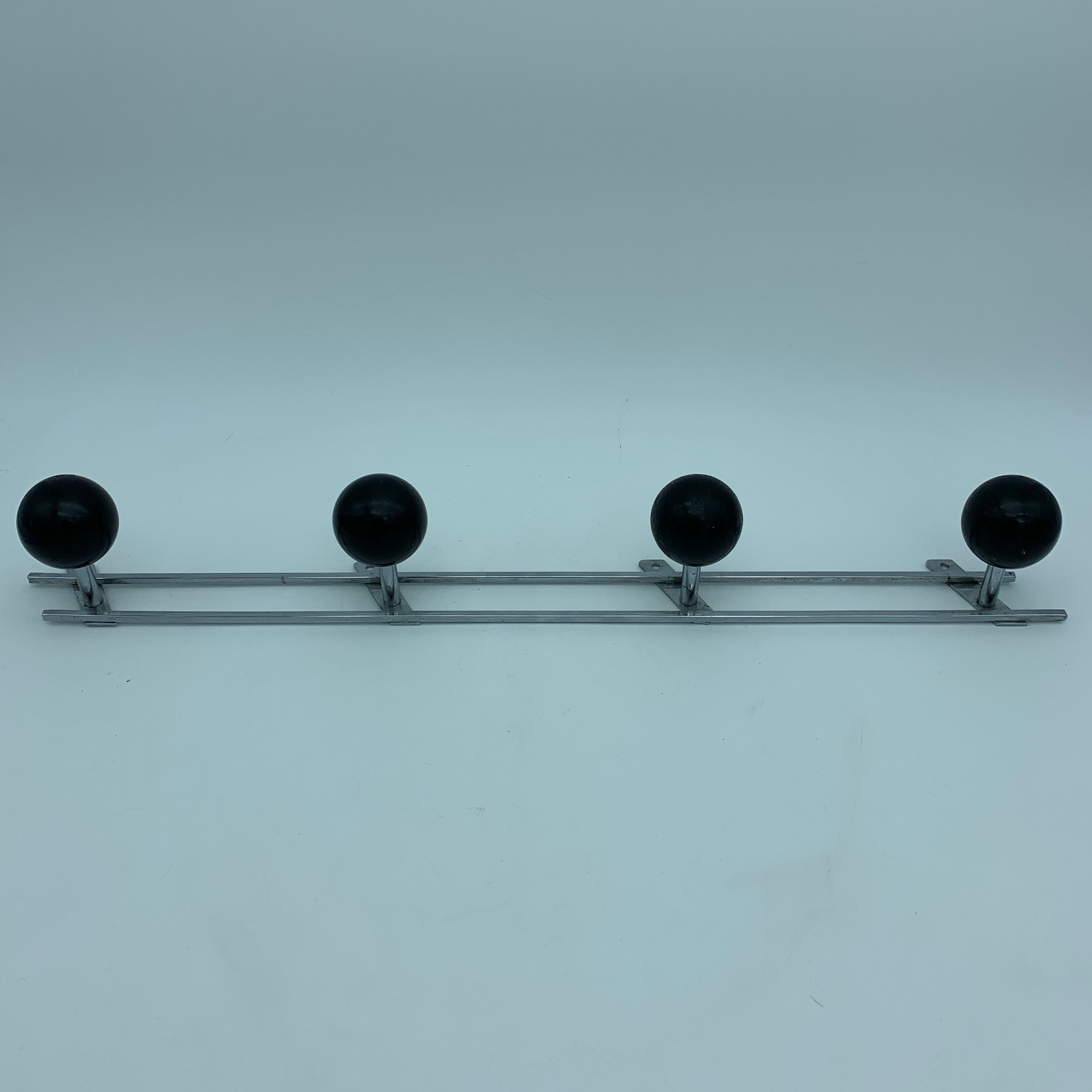 Coat holder 4 chrome steel pateres and black wooden balls
