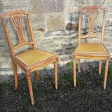 Pair of old chairs with brass elements