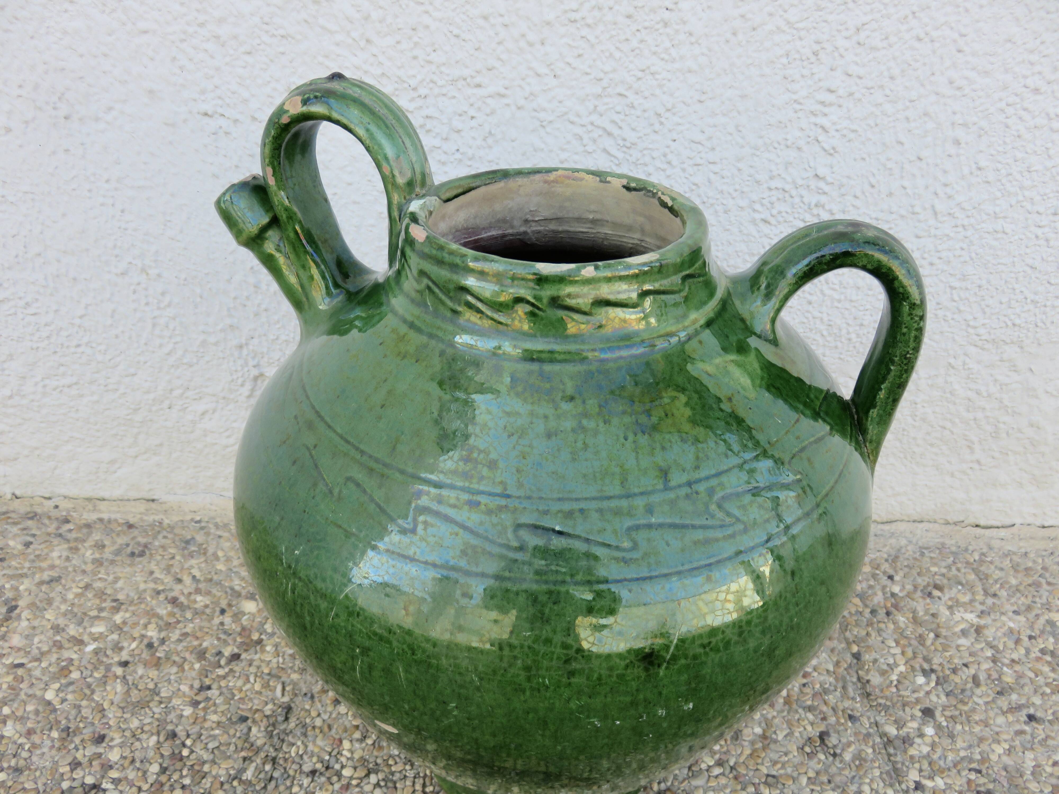 Antique glazed green terracotta oil jar, late 19th century.