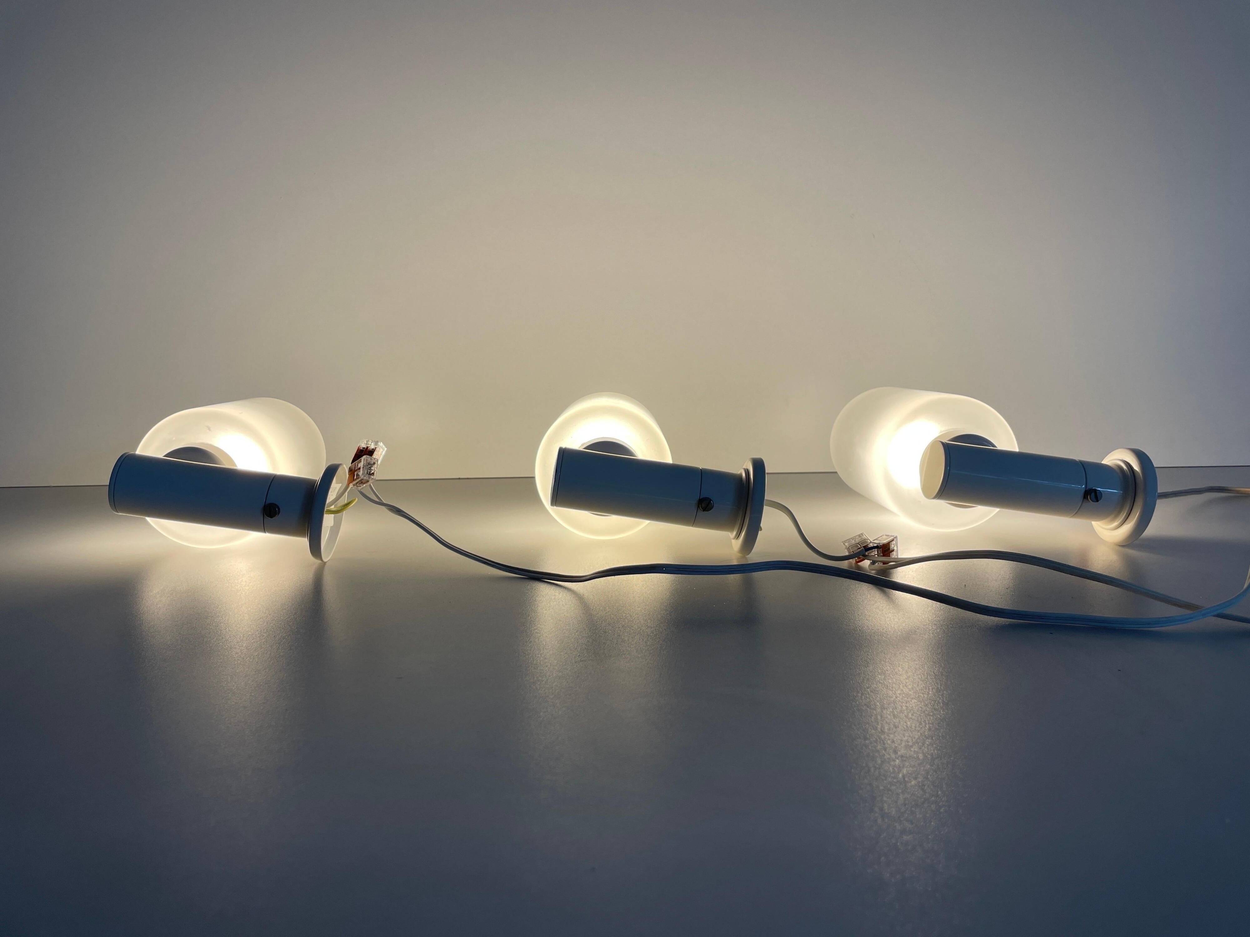 Set of 3 semi-transparent glass and white metal wall lights, 1960, Germany