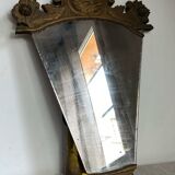 Antique wooden mirror with an unusual shape