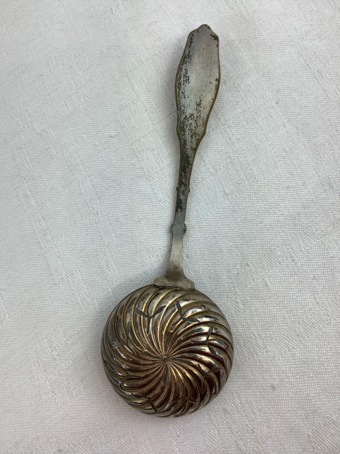 Old sprinkling spoon