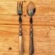 Vintage serving cutlery in horn and wrought metal