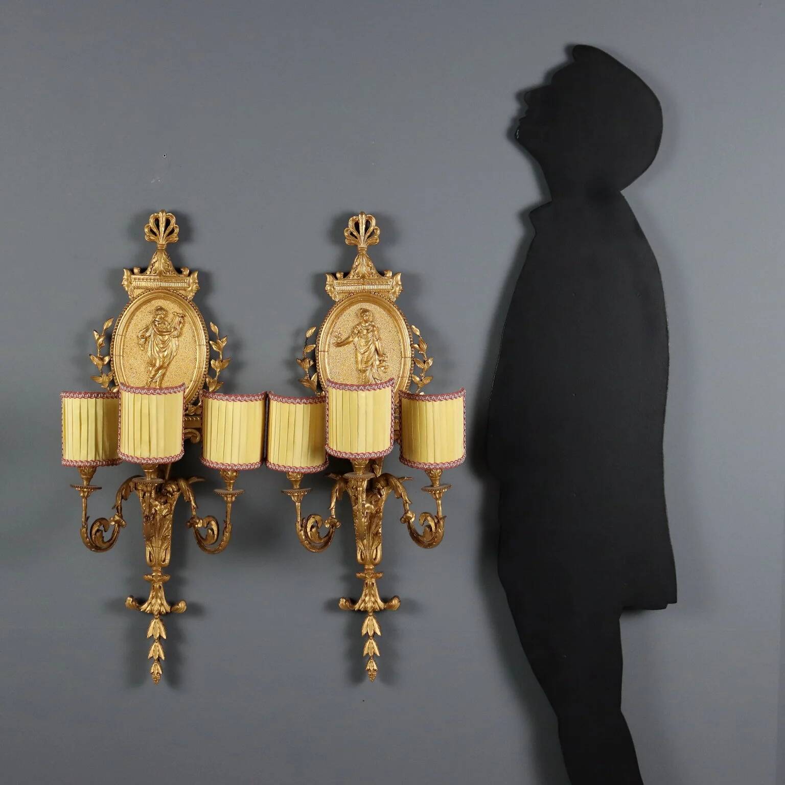 Antique neoclassical wall sconces in iron and wood, 19th century.