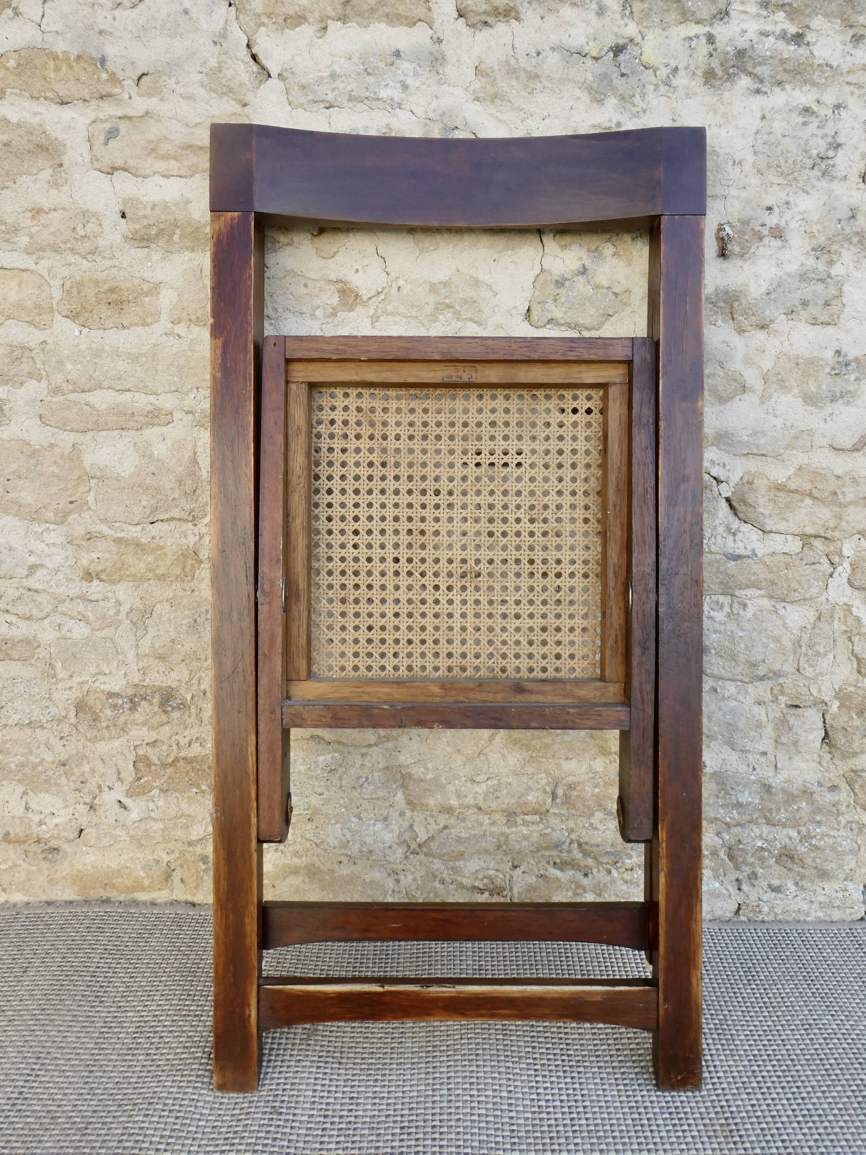 Wooden folding chair with caned seat